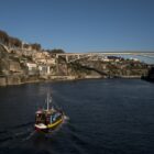 Rabelo boat Porto dramatically perched at the mouth of the Rio Douro