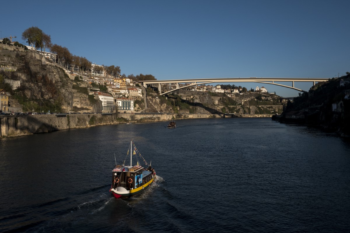 Rabelo boat Porto dramatically perched at the mouth of the Rio Douro